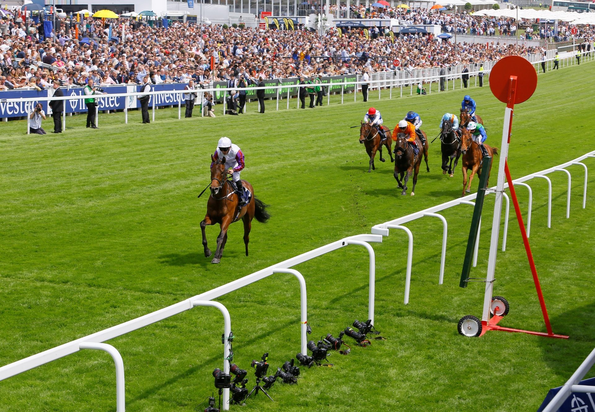 Cosmic Law (No Nay Never) winning the Woodcote Stakes at Epsom