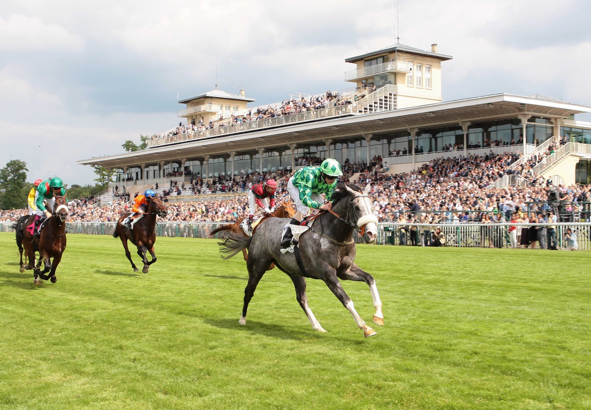 The Grey Gatsby (Mastercraftsman) winning the G1 Prix du Jockey Club at Chantilly